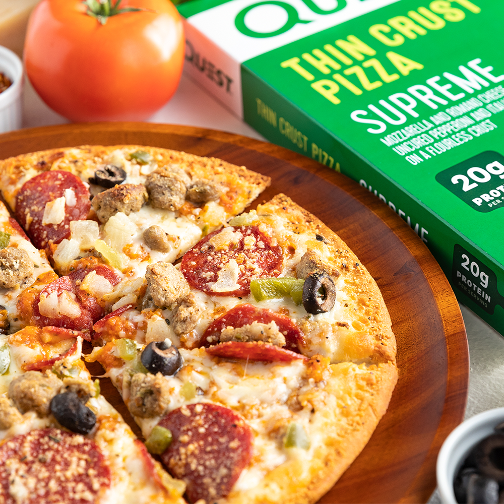 supreme-pizza-e1 QN_US_ThinCrustPizza_Supreme_103210_Tabletop_04.png